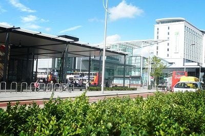 A picture of the bus station taken from the outside looking into the station